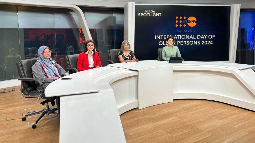 Cover image of panelists and host seated at a table in Astro Awani with a screen of text behind them stating, "International Day of Older Persons 2024."